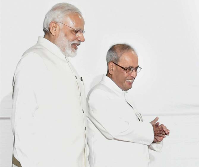 President Pranab Mukherjee with Prime Minister Narendra Modi proceeds to Centra Hall for his farewell ceremony at Parliament. Pic/AFP