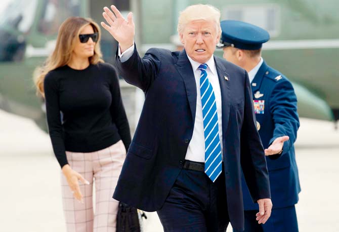 President Donald Trump and First Lady Melania Trump walk to board Air Force One as they travel  to Poland and Germany. Pic/AFP