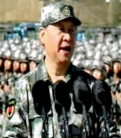 In this image taken from a video, Chinese President Xi Jinping inspects troops of the People