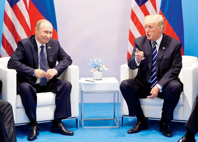 Vladimir Putin and Donald Trump meet on the sidelines of the G20 Summit in Hamburg. Pic/AFP