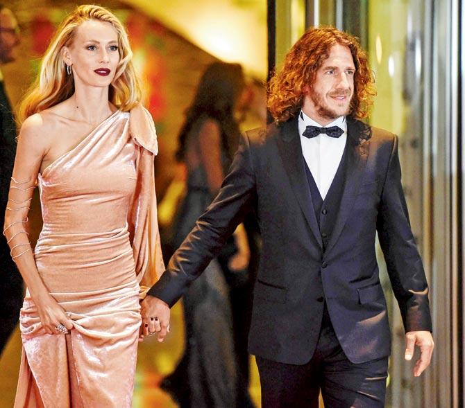 Puyol makes an entry with wife Vanessa