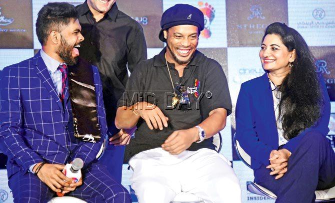 Ex-Brazilian footballer Ronaldinho (centre) shares a light moment with Premier Futsal owners Dinesh Raj (left) and Vimala Britto during a media briefing at a city hotel yesterday. Pic/Atul Kamble
