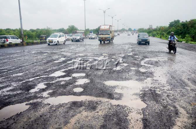 Potholes at the Vashi junction of the Sion-Panvel highway. Pic/Suresh Karkera