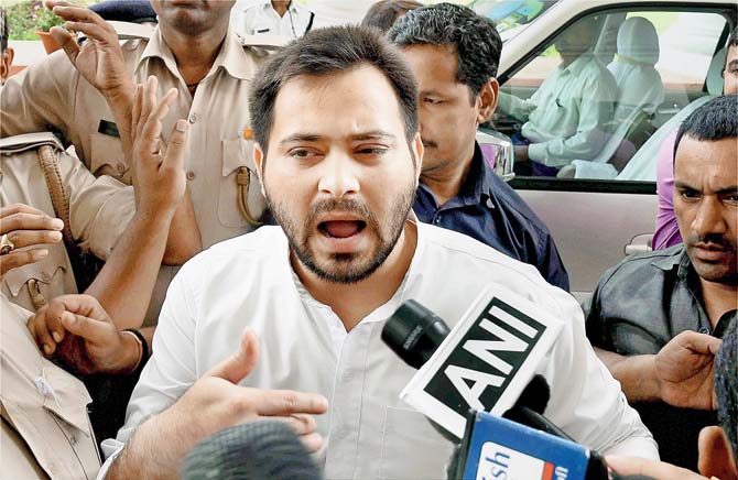 Tejaswi Yadav alleged that BJP president Amit Shah and Prime Minister Narendra Modi were conspiring against him and his family members out of political reasons. Pics/PTI