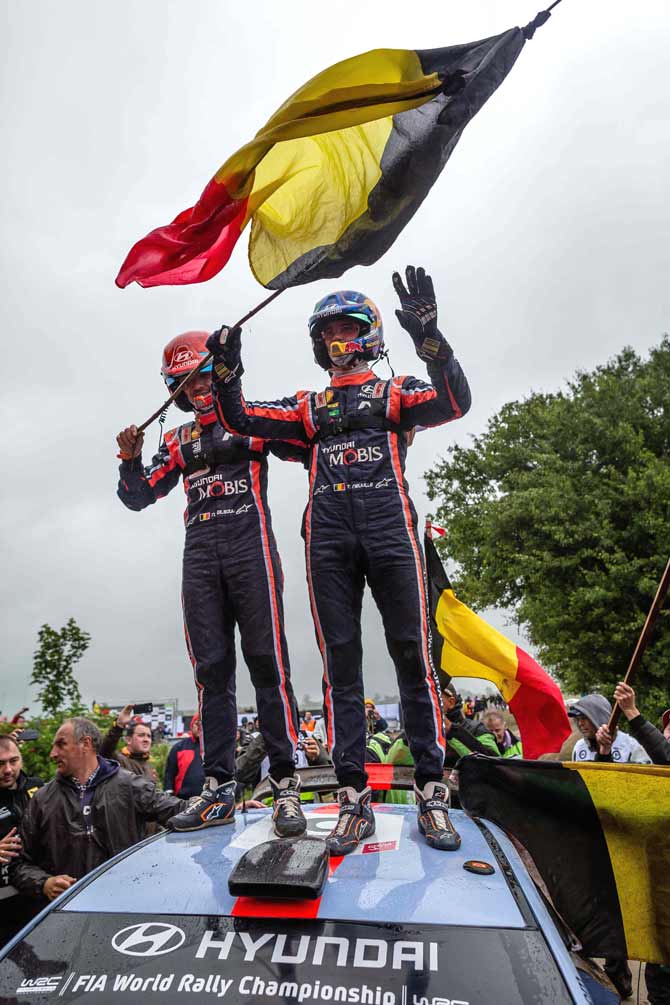 Belgium Thierry Neuville (R) from Belgium and his co-driver Nicolas Gilsoul (L) stand on the roof of their Ford Fiest WRC as they celebrate first place vicotry of the Rally of Poland in Paprotki