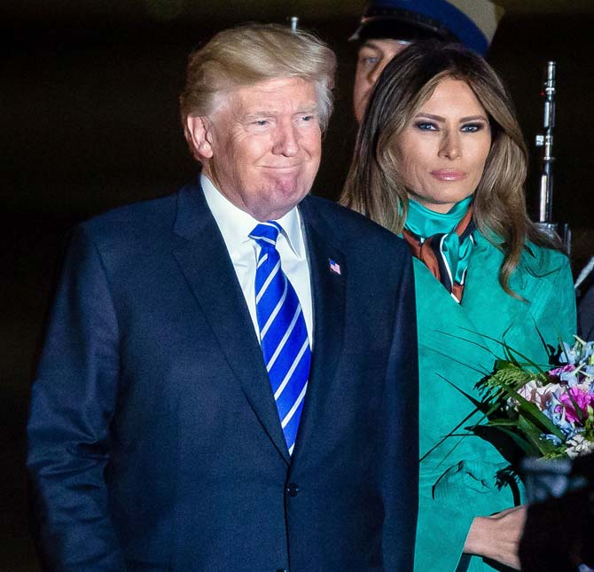 US President Donald Trump (L) and US First Lady Melania Trump (R) react after stepping off Air Force One upon their arrival at Chopin Airport in Warsaw. Pic/AFP
