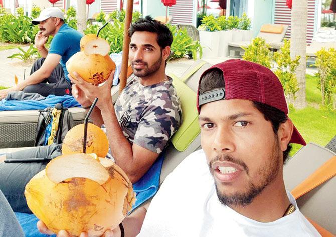Pacers Bhuvneshwar Kumar and Umesh Yadav enjoy coconut water