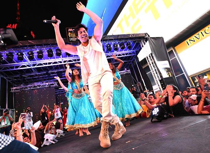 Varun Dhawan performs on stage during the IIFA Stomp in Times Square. Pic/AFP