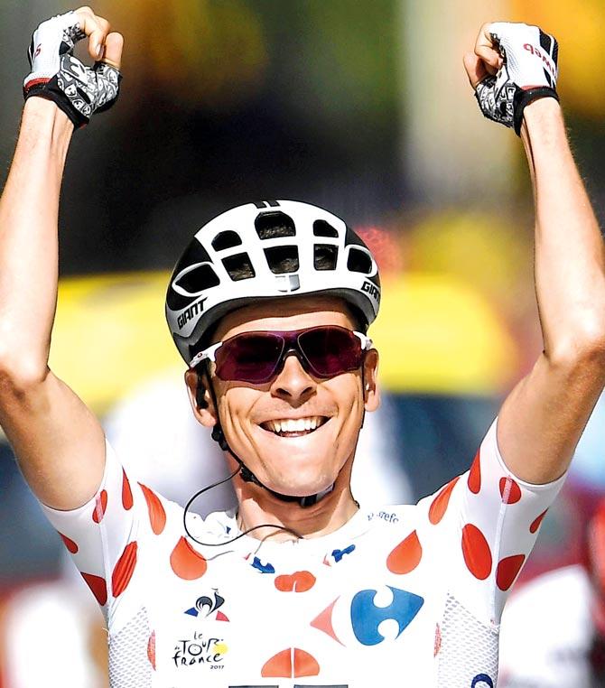 Frenchman Warren Barguil celebrates after winning Stage 13 of the Tour de France yesterday. Pic/AFP