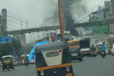 Watch video: Car catches fire near Andheri Metro