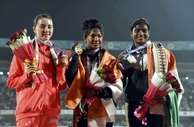 Gold medalist Swapna Barman of India (C) Meg Hemphill of Japan (Silver) and India