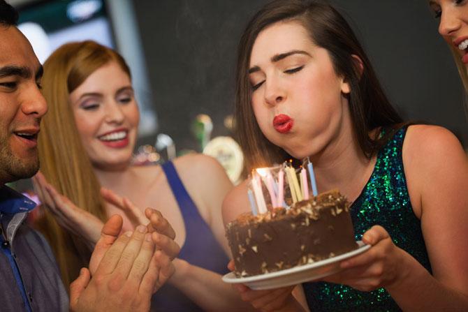 Blowing out birthday candles ups bacteria on cake by 1,400 pc