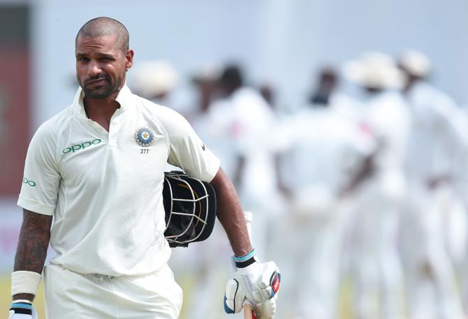 Shikhar Dhawan leaves the pitch after being dismissed