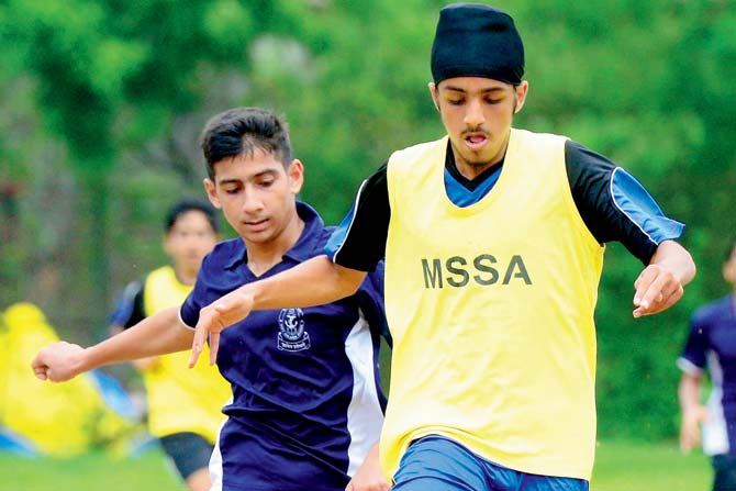 Anshveer Nagpal of Jamnabai Narsee, Juhu (right) during the MSSA Div I U-16 football tournament at Azad Maidan on Saturday. pc/ Suresh Karkera