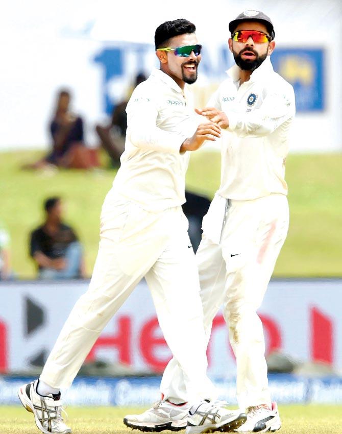 Ravindra Jadeja (left) celebrates the wicket of Sri Lanka