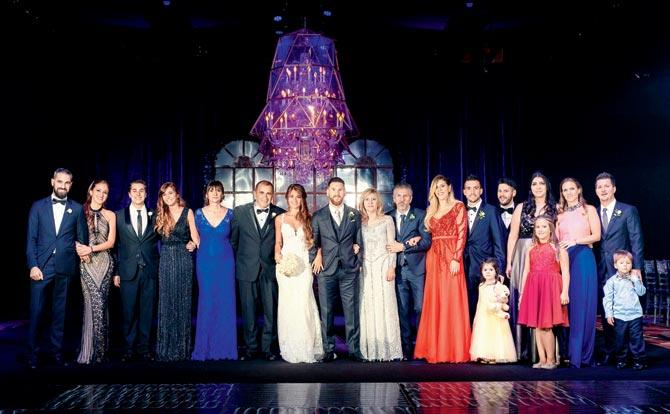 Messi and his wife Antonella pose with their relatives during the wedding party in Rosario