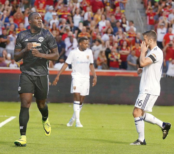 Lukaku (left) celebrates his maiden United goal during a friendly match vs Real Salt Lake in Utah on Monday. Pic/Getty Images