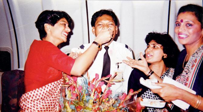 Former flight attendant Sheela Karunakaran (right) and other crew members