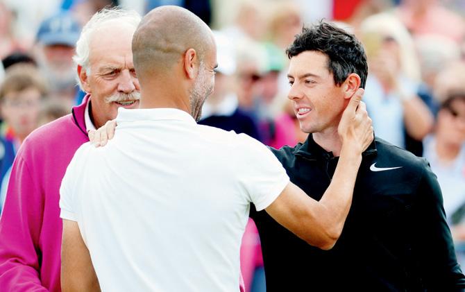 Guardiola with Irish golfer Rory McIlroy on Wednesday. Pics/getty images