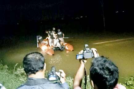 Duo escape after BMW gets trapped in riverbed in Pune