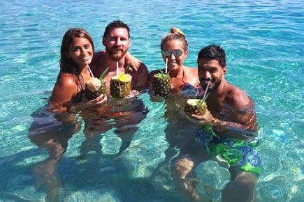 Luis Suarez gatecrashes Lionel Messi's honeymoon in the Caribbean!
