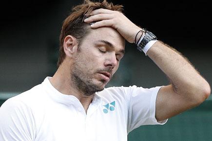 Stanislas Wawrinka exits Wimbledon after loss and a bad knee