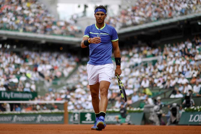 Rafael Nadal walks on the court during his match against Robin Haase. Pic/ AFP