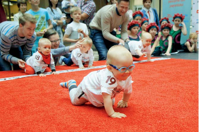 Ten-month-old Mykolas Pociunas crawled to victory to be crowned Lithuania’s fastest toddler, lured across the finish line by a box of Lego plastic bricks. pics/afp