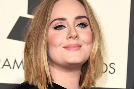 Adele visits London apartment building after deadly fire