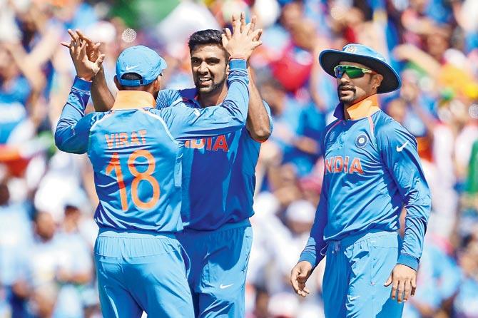 India off-spinner R Ashwin (right) celebrates South African Hashim Amla’s wicket with captain Virat Kohli during the ICC Champions Trophy match at The Oval in London on Sunday. Pic/AFP