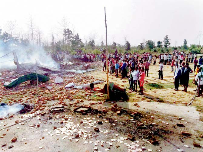 People at the site of the fire crackers factory at Balaghat. Pic/PTI