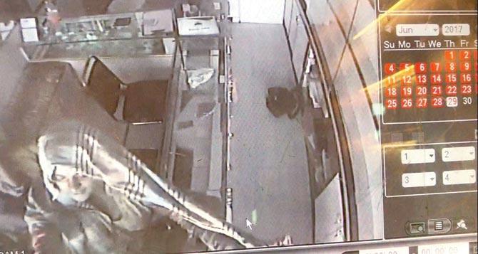 A CCTV grab shows two of the women leaving the shop after the theft