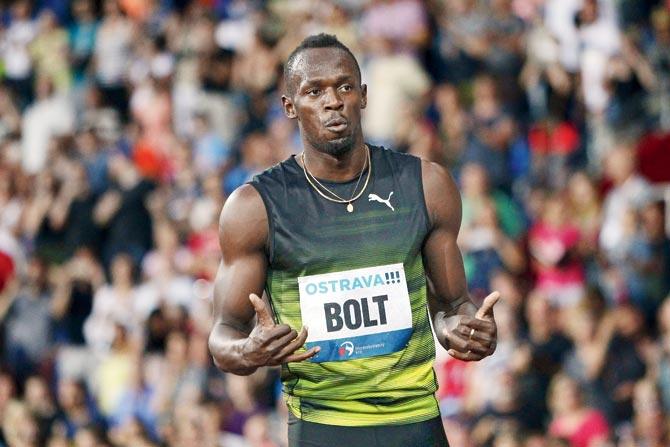 Bolt celebrates after winning gold in the 100m event during the IAAF Golden Spike event. Pic/AFP