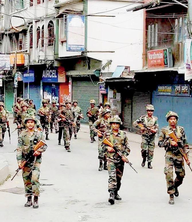 CRPF troops patrol the streets in Darjeeling yesterday. Pic/PTI