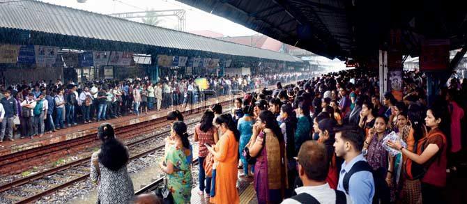Heavy rain delayed train services between Kalyan, Dombivli and Thane. Pic/ Satej Shinde