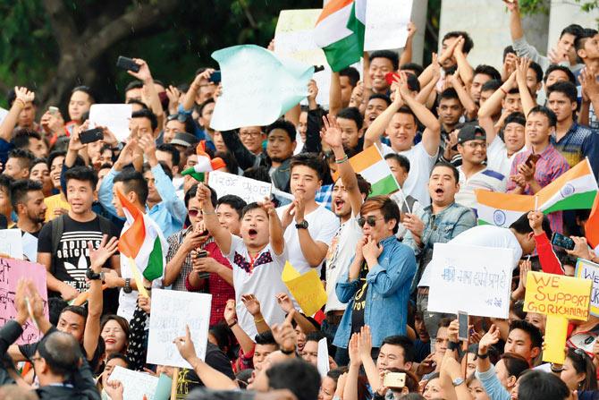 Members of the Gorkha community during a demonstration in Bangalore demanding a separate Gorkhaland . The indefinite bandh in the Darjeeling hills will continue until security forces are withdrawn, a GJM-sponsored all-party meeting decided yesterday. Pic/AFP