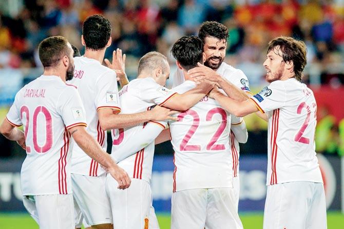 Spain’s Diego Costa (second from right) celebrates a goal with his teammates during their 2-1 World Cup qualifying win over Macedonia on Sunday. Pic/AFP