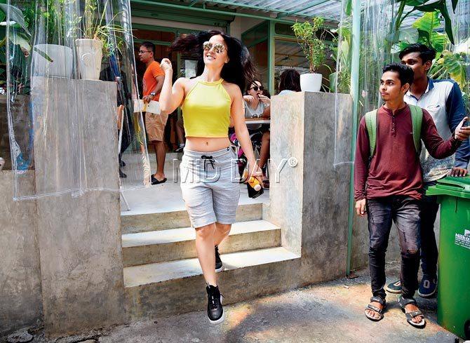 Actress Elli Avram exits a Bandra restaurant with a spring in her step on Saturday afternoon. Pic/Shadab Khan