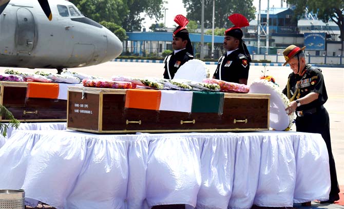 Army chief Gen Bipin Rawat pays homage to slain soldiers Naik Dipak Maity of Midnapore in Bengal and gunner Manivannan G. of Tamil Nadu at AFS Palam in New Delhi. Pic/AFP