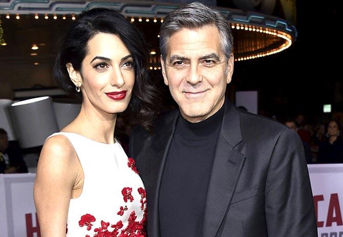 George Clooney with wife Amal. Pic/AFP