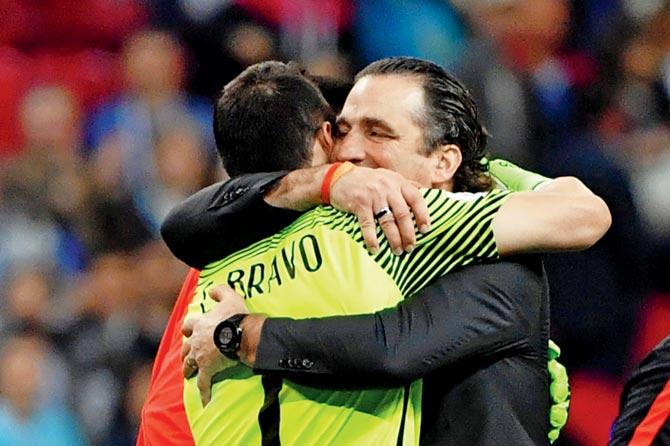 Chile’s coach Juan Antonio Pizzi (left) celebrates with ’keeper Claudio Bravo on Wednesday
