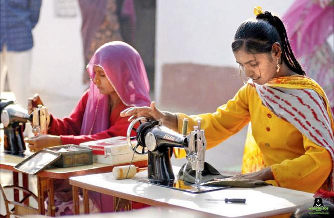Kalandar women learn tailoring as part of a skill-training course