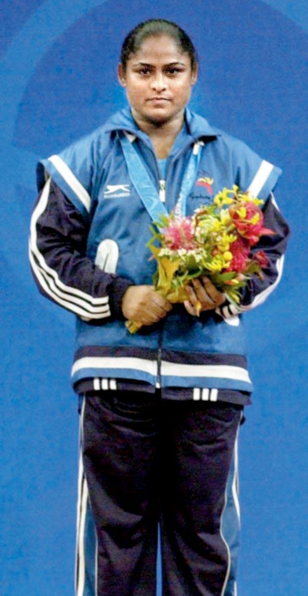 India’s Karnam Malleswari on the podium with her bronze at Sydney in 2000. Pic/AFP