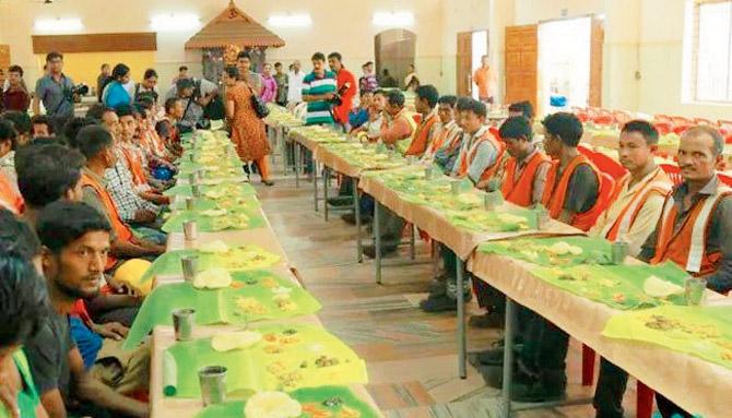 The workers at the traditional sadhya after which they danced