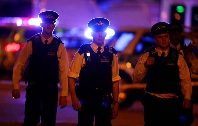 Police guard a street in the Finsbury Park area of north London where a vehichle hit pedestrians. Pic/AFP