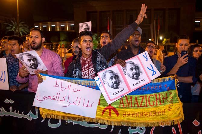 Protesters hold portraits of grassroots leader Nasser Zefzafi during a demonstration June 4, 2017 in Rabat in solidarity with Morocco. Pic/AFP