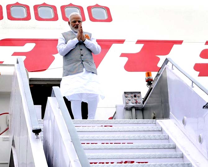 Prime Minister Narendra Modi on his arrival after a successful visit to Portugal, USA and Netherlands, at AFS Palam in New Delhi. Pic/AFP