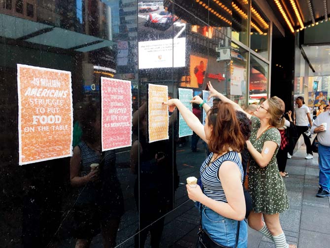 Commuters trying to burst the bubble wraps at a station in New York City