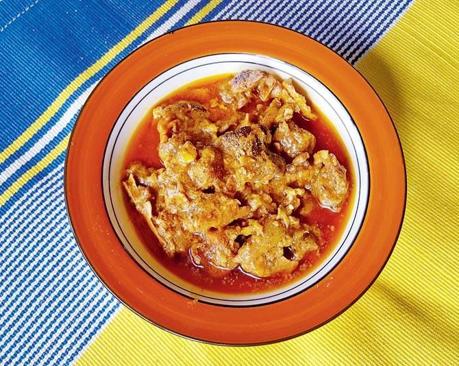 Pasoni Bhoja from Bodo tribe consists of pork trotters, offals and brain