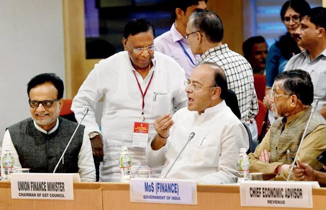 Union Minister for Finance and Corporate Affairs Arun Jaitley with MoS Santosh Gangwar, Revenue Secretary Hasmukh Adhia and Puducherry Chief Minister, V Narayanasamy at the GST Council Meeting in New Delhi yesterday. Pic/PTI